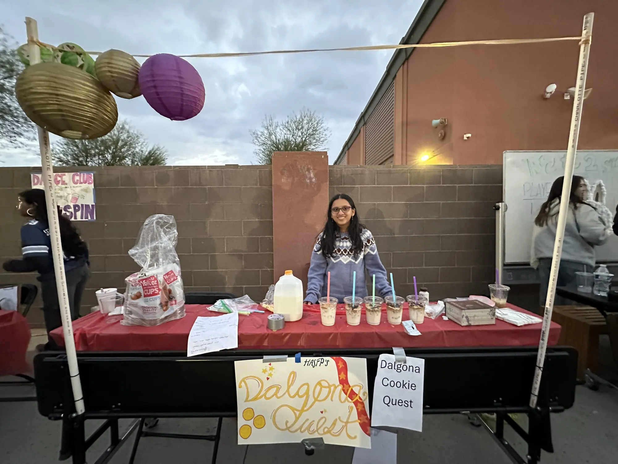 A student runs the dalgona cookie challenge booth